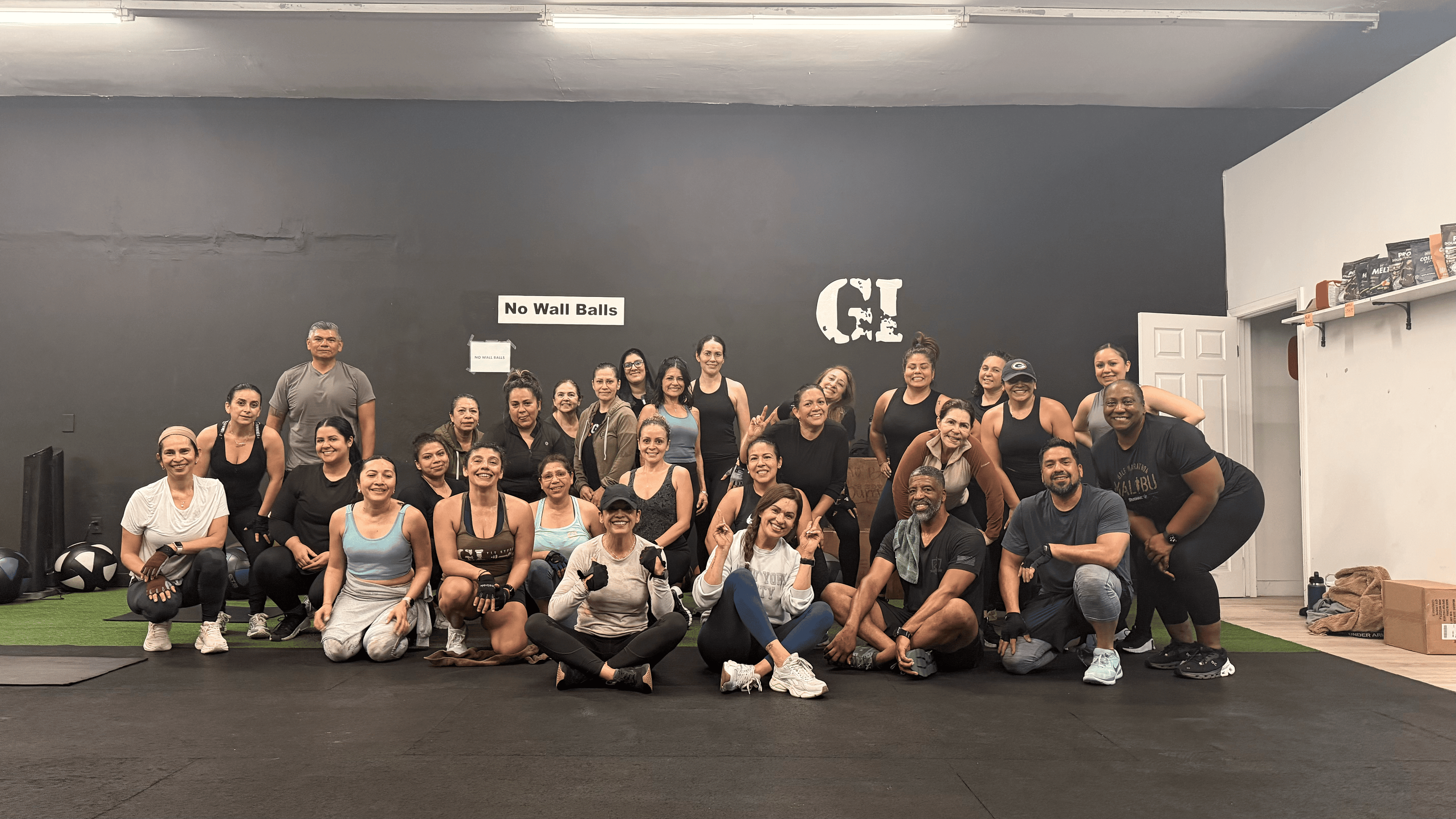 GI Fit Studio family — coaches and members together